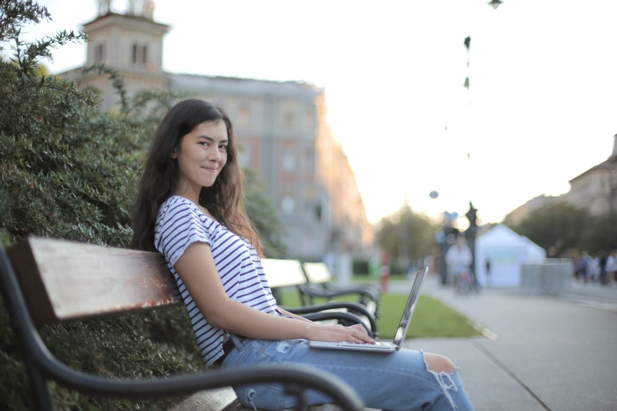 Photo by Andrea Piacquadio from Pexels: https://www.pexels.com/photo/woman-in-black-and-white-striped-shirt-sitting-on-wooden-bench-3808778/