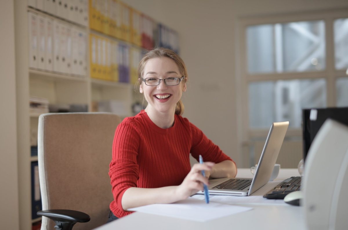 Photo by Andrea Piacquadio from Pexels: https://www.pexels.com/photo/woman-in-red-sweater-leaning-on-white-table-3783725/