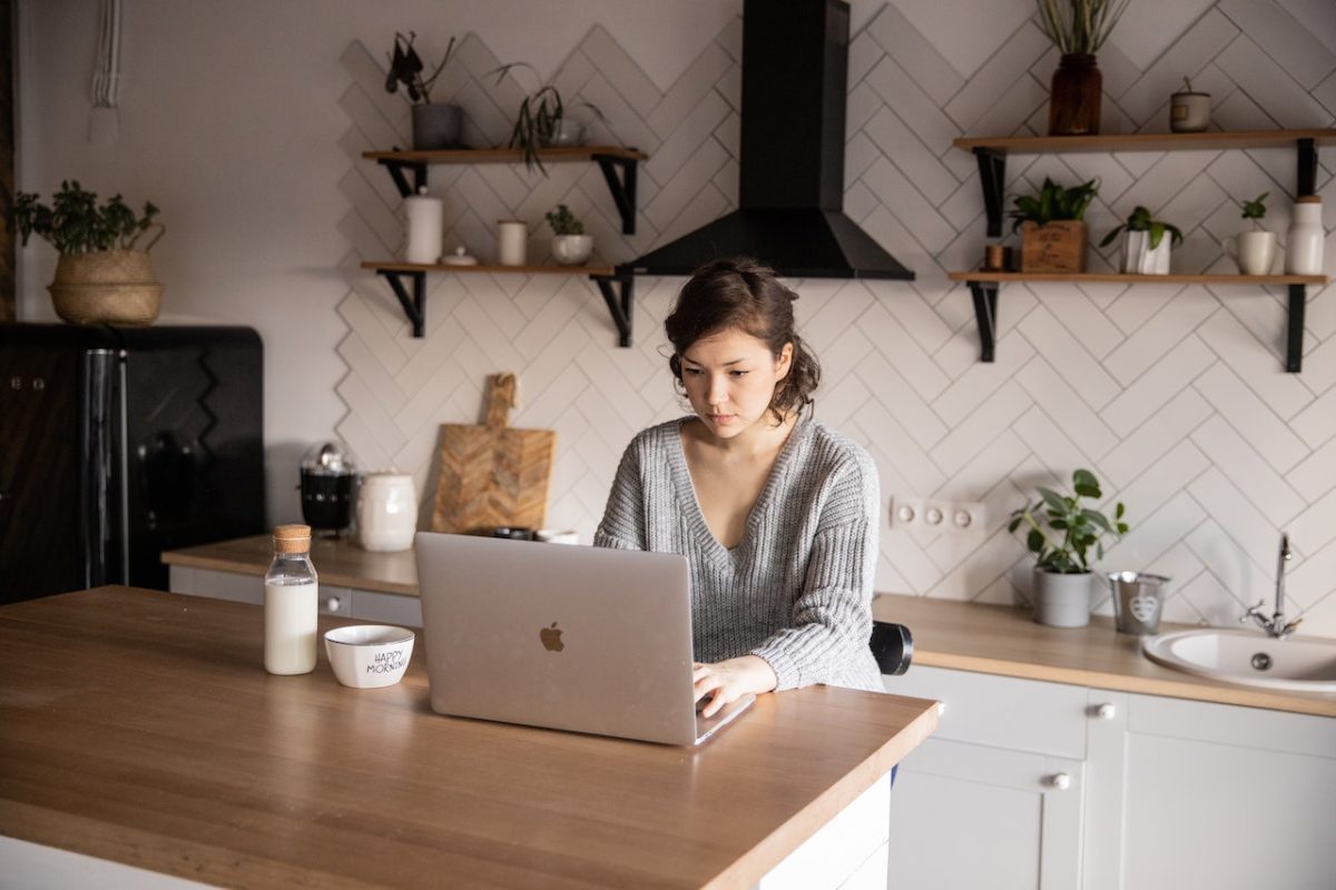 Photo by EKATERINA BOLOVTSOVA: https://www.pexels.com/photo/content-young-woman-browsing-laptop-in-modern-kitchen-4049793/