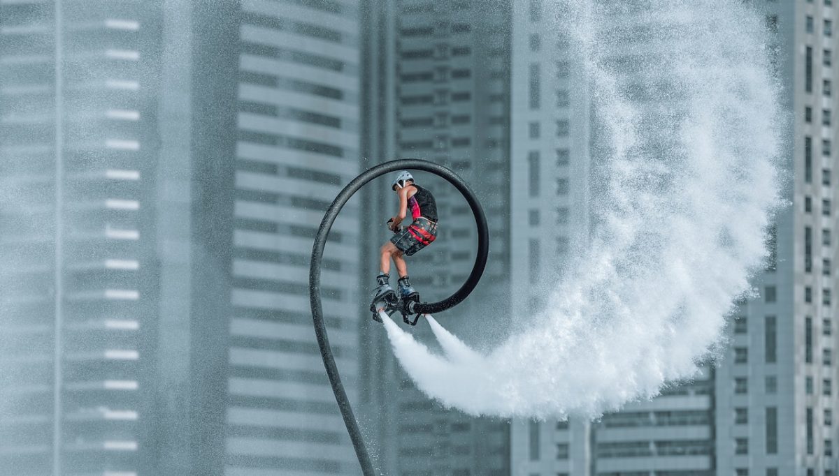 Photo by Abed Ismail: https://www.pexels.com/photo/man-in-red-jacket-riding-bicycle-on-white-water-wave-7799780/