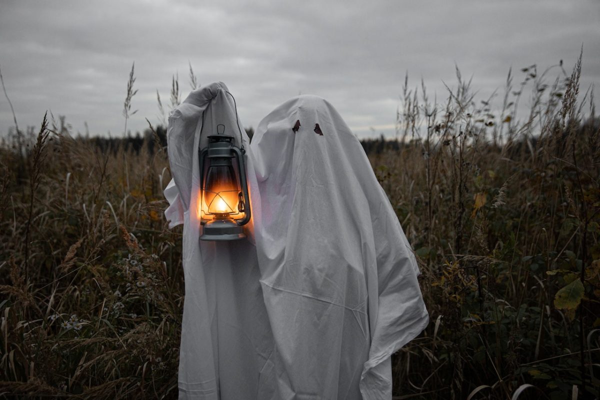 Photo by Monstera Production: https://www.pexels.com/photo/personin-ghost-costume-holding-a-lantern-5635106/