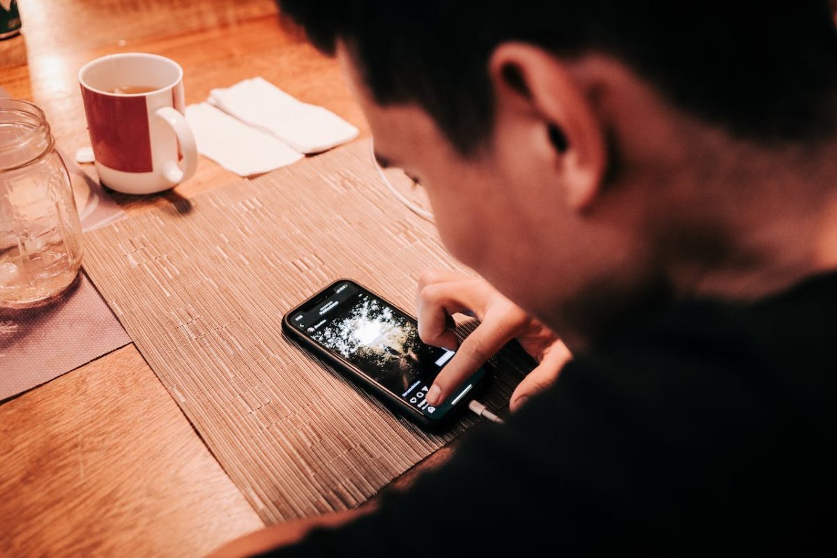 Photo by Luis Quintero: https://www.pexels.com/photo/man-touching-smartphone-on-wooden-table-3695352/